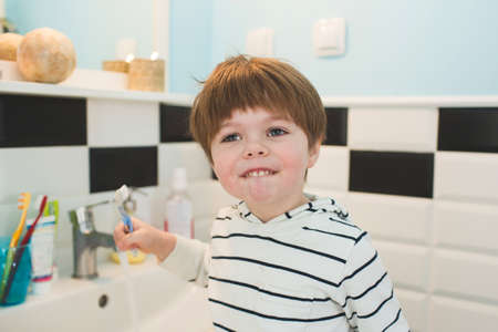 Little boy brushing teethの写真素材