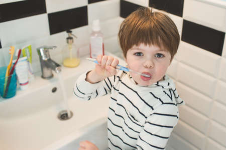 Little boy brushing teethの写真素材