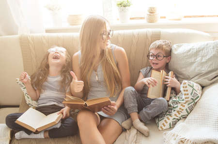 Happy family reading books togetherの写真素材