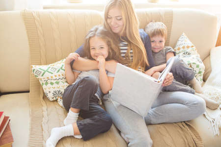 Happy family reading books togetherの写真素材