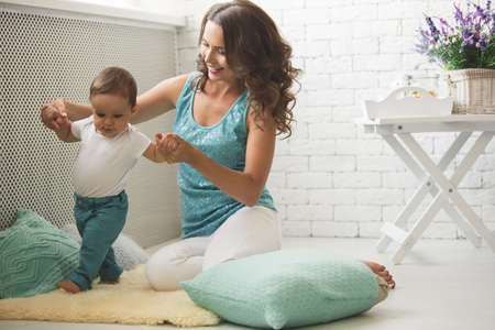 A young mother and son having fun togetherの写真素材