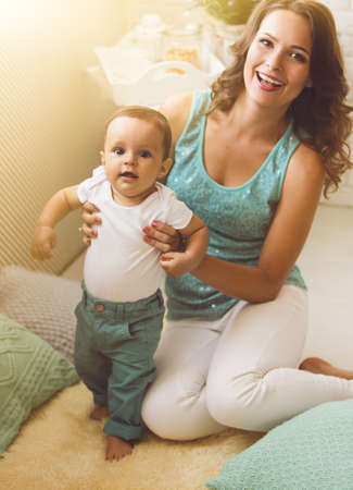 A young mother and son having fun togetherの写真素材