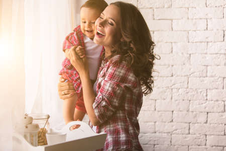 A young mother and son having fun togetherの写真素材