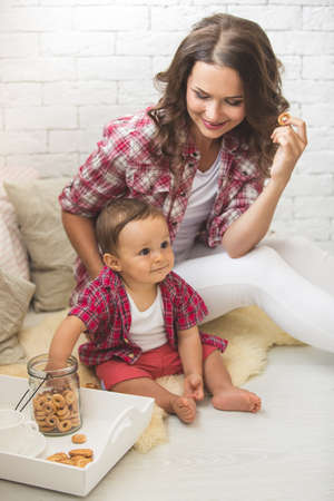 A young mother and son having fun togetherの写真素材