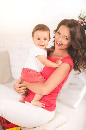 A young mother and son having fun togetherの写真素材