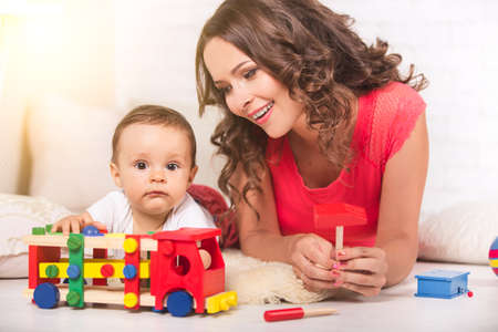 A young mother and son having fun togetherの写真素材