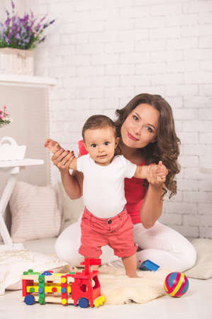 A young mother and son having fun togetherの写真素材