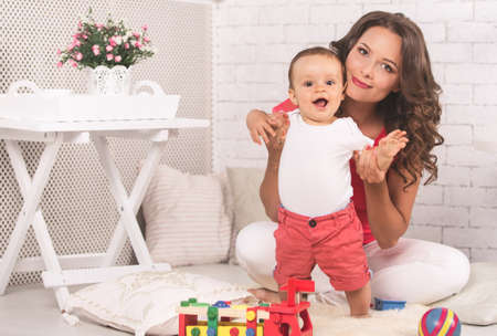 A young mother and son having fun togetherの写真素材