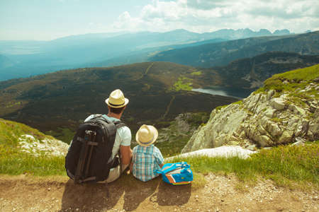 Father and son traveling in Rila mountains Bulgariaの写真素材