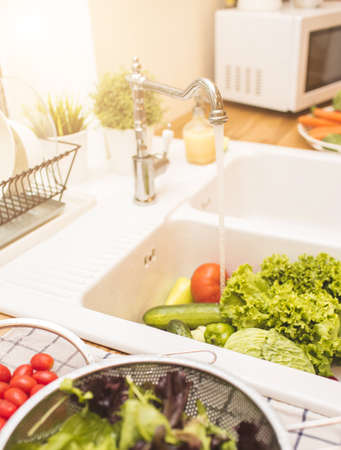 Vegetables lie in the sinkの写真素材