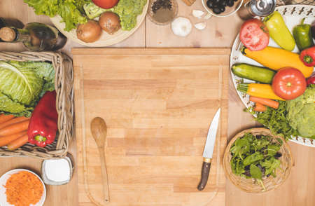 Vegetables on a wooden table top viewの写真素材