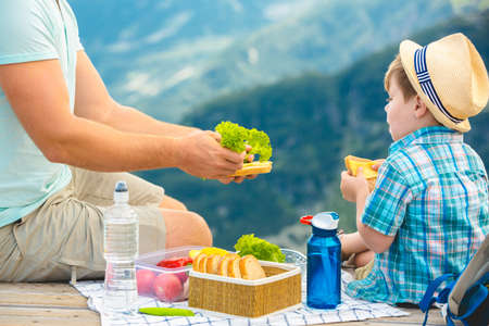 Family on a picnic in the mountainsの写真素材