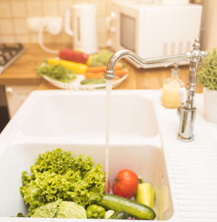 Vegetables lie in the sinkの写真素材
