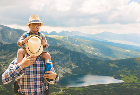 Father and son traveling in Rila mountains Bulgariaの写真素材