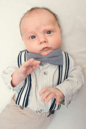 newborn baby dressed like gentlemanの写真素材