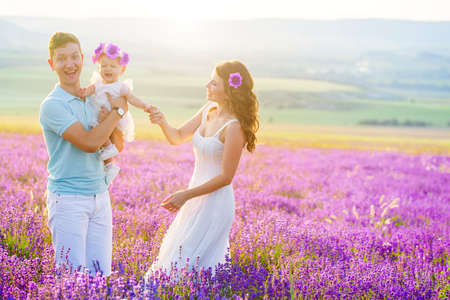 Young family in a lavender fieldの写真素材