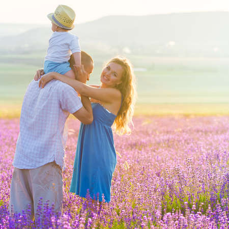 Young family in a lavender fieldの写真素材