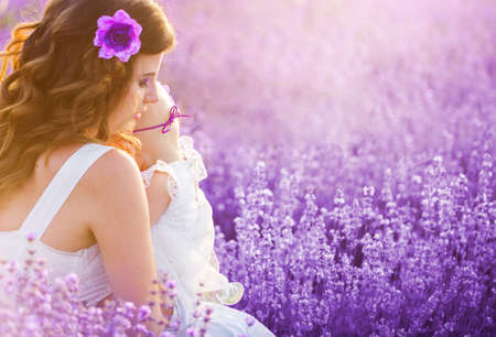 Mom and her daughter in a lavender fieldの写真素材