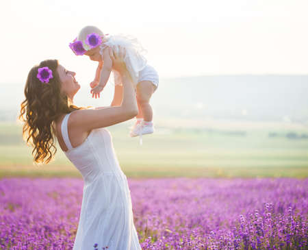Mom and her daughter in a lavender fieldの写真素材