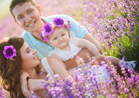 Young family in a lavender fieldの写真素材