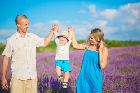 Young family in a lavender fieldの写真素材