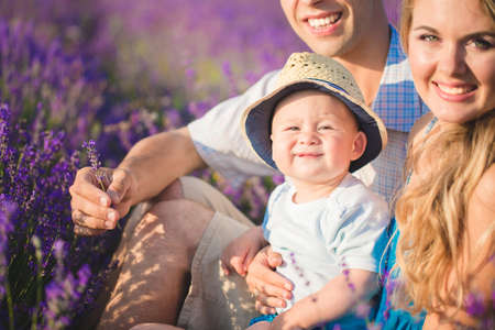 Young family in a lavender fieldの写真素材