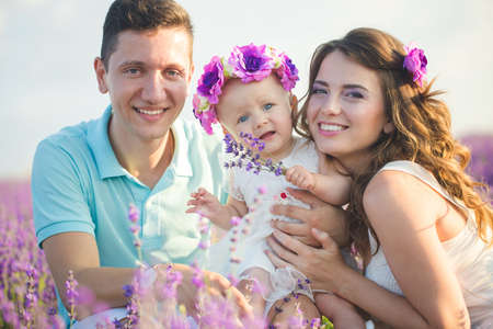 Young family in a lavender fieldの写真素材