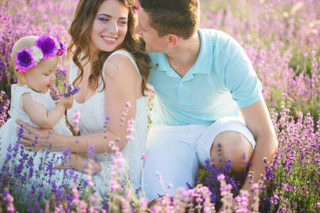 Young family in a lavender fieldの写真素材
