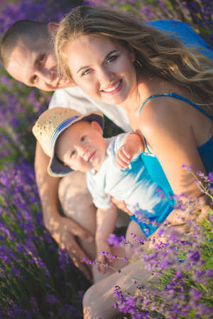 Young family in a lavender fieldの写真素材