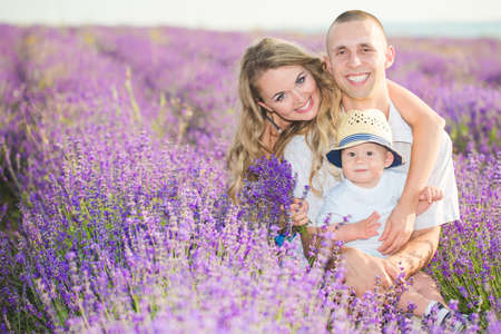 Young family in a lavender fieldの写真素材