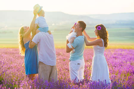 Two friendly family in a lavender fieldの写真素材