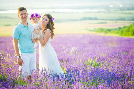 Young family in a lavender fieldの写真素材