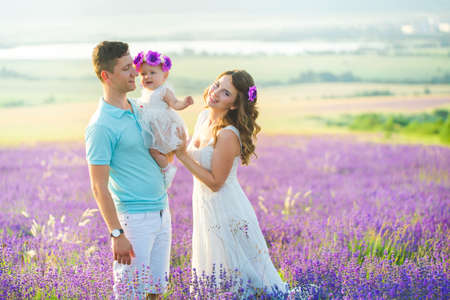 Young family in a lavender fieldの写真素材