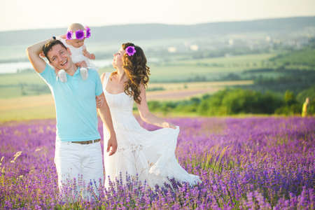 Young family in a lavender fieldの写真素材