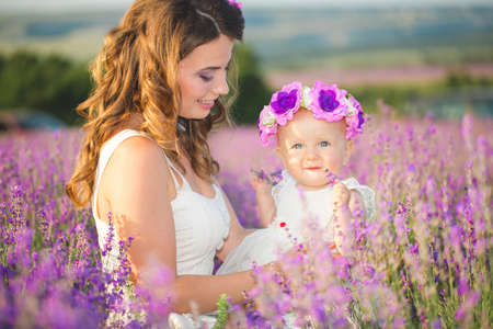 Mom and her daughter in a lavender fieldの写真素材