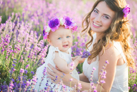 Mom and her daughter in a lavender fieldの写真素材