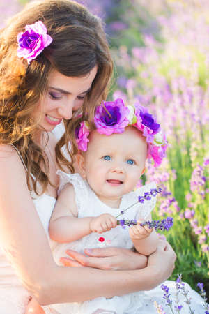 Mom and her daughter in a lavender fieldの写真素材