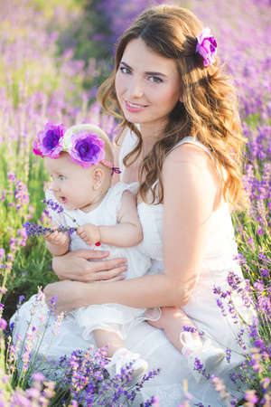 Mom and her daughter in a lavender fieldの写真素材