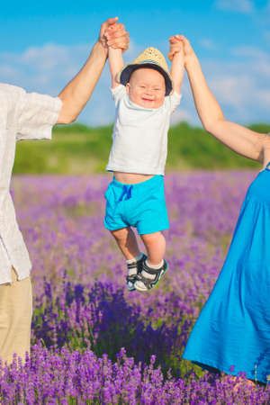 Young family in a lavender fieldの写真素材