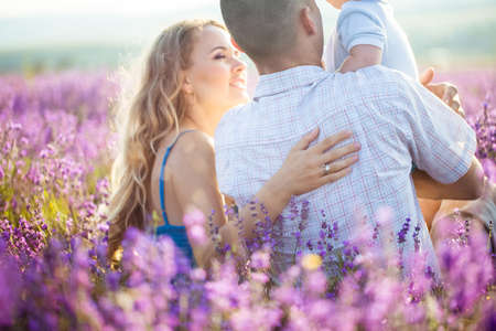Young family in a lavender fieldの写真素材