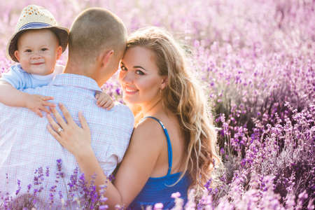 Young family in a lavender fieldの写真素材