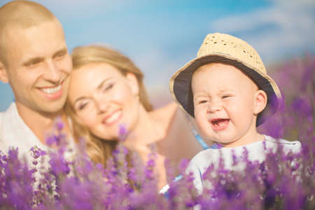 Young family in a lavender fieldの写真素材
