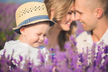 Young family in a lavender fieldの写真素材