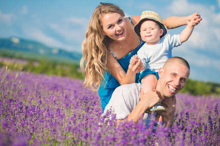 Young family in a lavender fieldの写真素材