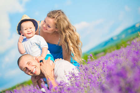 Young family in a lavender fieldの写真素材
