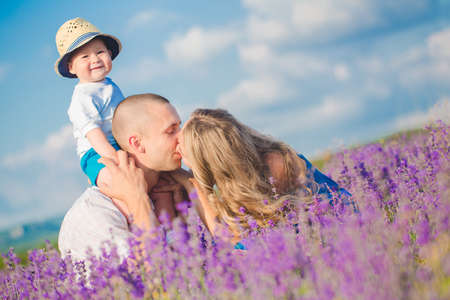 Young family in a lavender fieldの写真素材