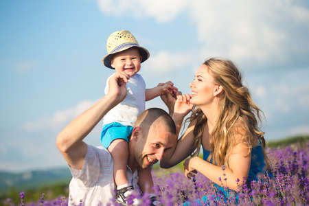 Young family in a lavender fieldの写真素材