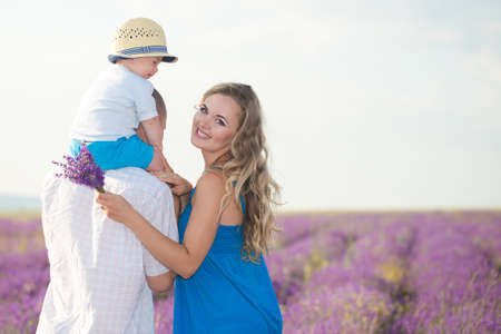 Young family in a lavender fieldの写真素材