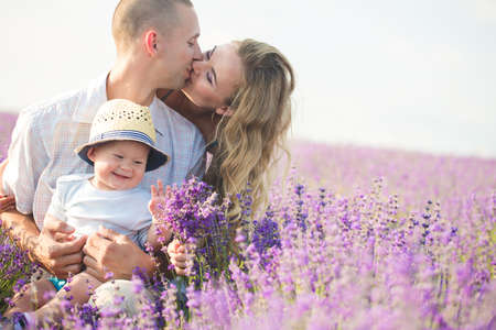 Young family in a lavender fieldの写真素材