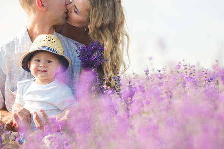 Young family in a lavender fieldの写真素材